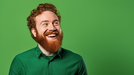 Man smiling on green background. - obrazy, fototapety, plakaty