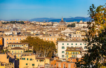 Fototapeta na wymiar Gorgeous aerial view of the city center in Rome at sunny sunset