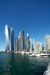 Cityscape and skyscraper at sunset in Dubai Marina.	