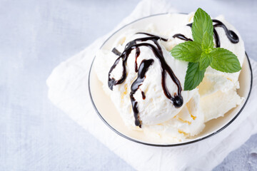 Bowl of vanilla ice cream isolated on white background