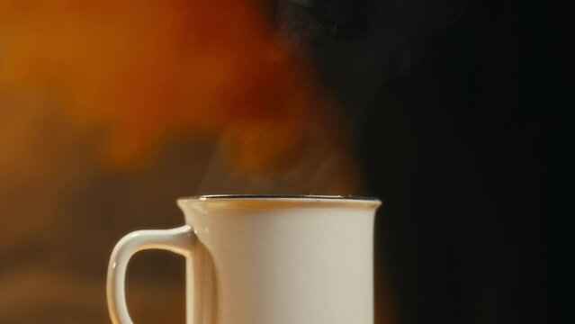 Hot coffee mug in the morning. Delicious drink to start the day. Steaming hot beverage.