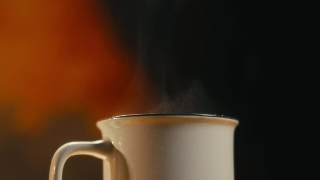 Hot coffee mug in the morning. Delicious drink to start the day. Steaming hot beverage.