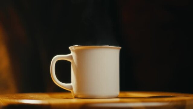 Hot coffee mug in the morning. Delicious drink to start the day. Steaming hot beverage.