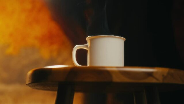 Hot coffee mug in the morning. Delicious drink to start the day. Steaming hot beverage.