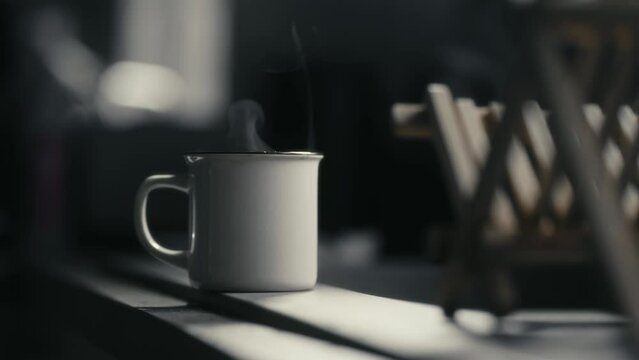 Hot coffee mug in the morning. Delicious drink to start the day. Steaming hot beverage.