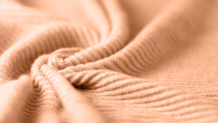 Coral pink alpaca wool texture as background with copy space.