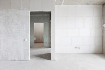interior of the apartment without decoration in gray colors. rough finish