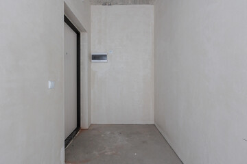 interior of the apartment without decoration in gray colors. rough finish