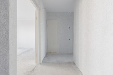 interior of the apartment without decoration in gray colors. rough finish