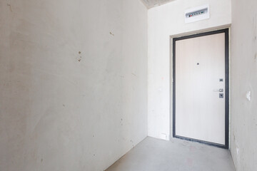 interior of the apartment without decoration in gray colors. rough finish