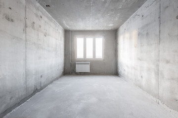 interior of the apartment without decoration in gray colors. rough finish