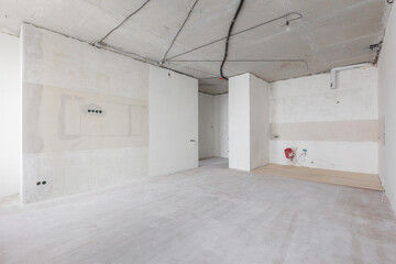interior of the apartment without decoration in gray colors. rough finish