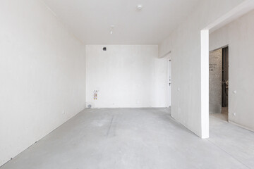 interior of the apartment without decoration in gray colors. rough finish