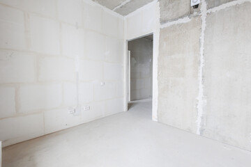 interior of the apartment without decoration in gray colors. rough finish