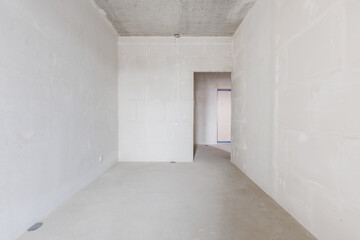 interior of the apartment without decoration in gray colors. rough finish