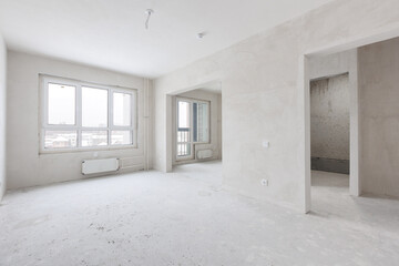 interior of the apartment without decoration in gray colors. rough finish