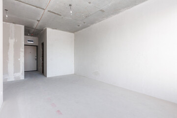 interior of the apartment without decoration in gray colors. rough finish
