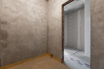 interior of the apartment without decoration in gray colors. rough finish