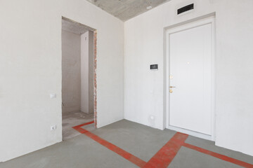 interior of the apartment without decoration in gray colors. rough finish