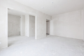 Fototapeta premium interior of the apartment without decoration in gray colors. rough finish