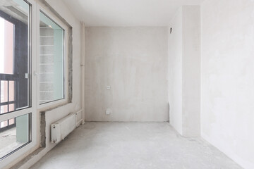 interior of the apartment without decoration in gray colors. rough finish
