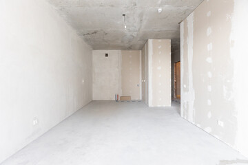 interior of the apartment without decoration in gray colors. rough finish