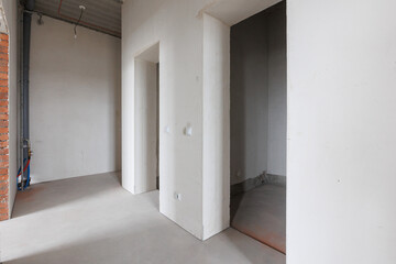 interior of the apartment without decoration in gray colors. rough finish