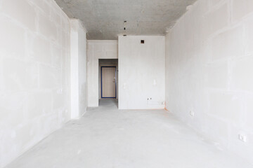 interior of the apartment without decoration in gray colors. rough finish