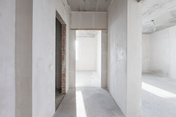 interior of the apartment without decoration in gray colors. rough finish