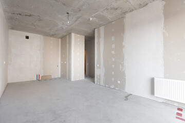 interior of the apartment without decoration in gray colors. rough finish