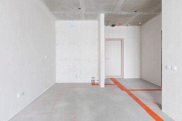 interior of the apartment without decoration in gray colors. rough finish