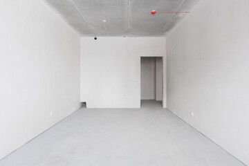 interior of the apartment without decoration in gray colors. rough finish