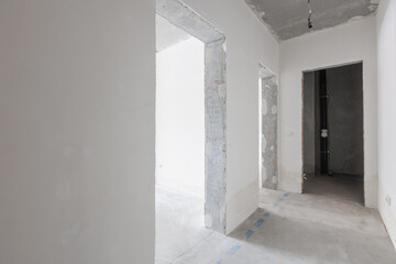 interior of the apartment without decoration in gray colors. rough finish