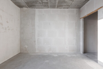 interior of the apartment without decoration in gray colors. rough finish