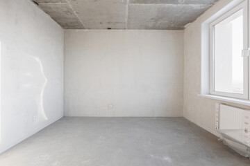 interior of the apartment without decoration in gray colors. rough finish