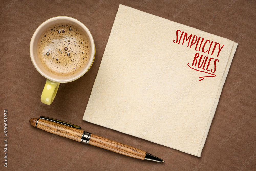 Wall mural simplicity rules inspirational note on a napkin with coffee - design and minimalism concept