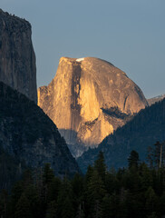 Half Dome Glows Orange In The Fading Light Of The Day
