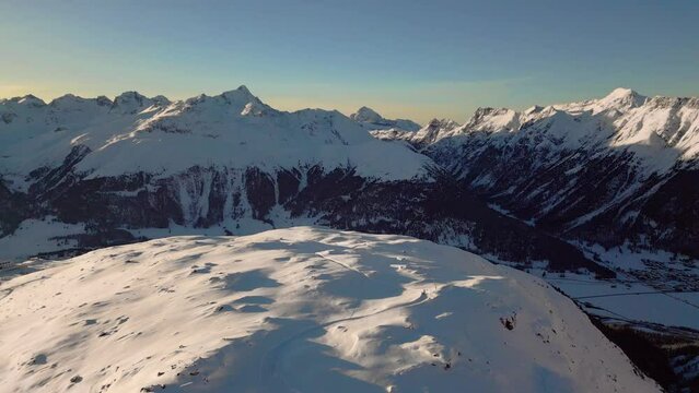 Snow covered mountains, Alps in Switzerland aerial drone footage