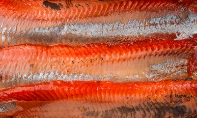Background of red fish fillet. Lightly salted fish.