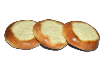Three sweet buns with cottage cheese, cheesecakes.