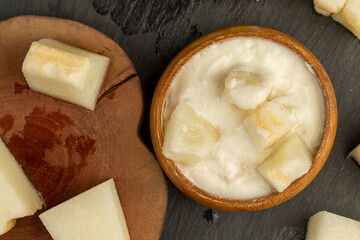 yogurt with melon flavor and ripe and delicious melon close-up