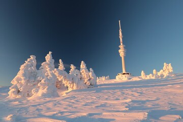 The top of Praděd mountain in the Czech Republic during sunrise - 690715363