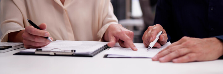 Legal broker reviewing contract documents