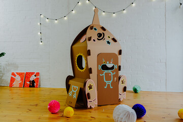 Rocket made of cardboard. Children art project. DIY concept. Cardboard craft.