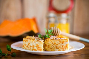 Cooked cottage cheese casserole with pieces of pumpkin inside.
