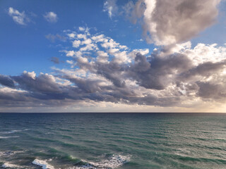 Obraz premium Beautiful Mediterranean warm sunset seascape with clouds, golden blue and purple 