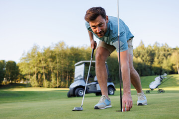 Emerging Triumph: Golfer Retrieves Last Ball