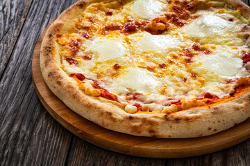 Margherita Pizza with tomato sauce and mozzarella cheese  on wooden background
