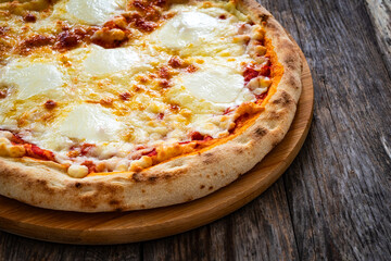 Margherita Pizza with tomato sauce and mozzarella cheese  on wooden background
