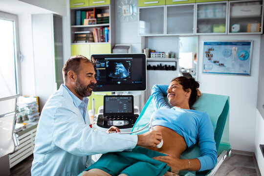 Expectant Mother Having Ultrasound with Doctor in Clinic